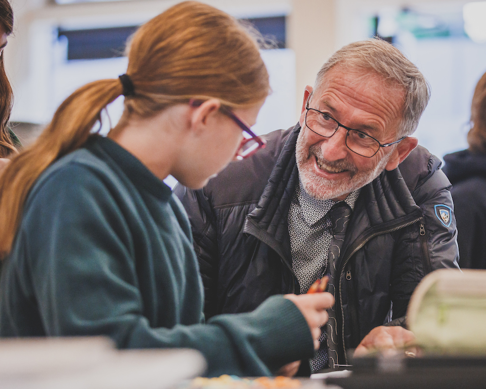 Faculty member helping a student understand a concept.